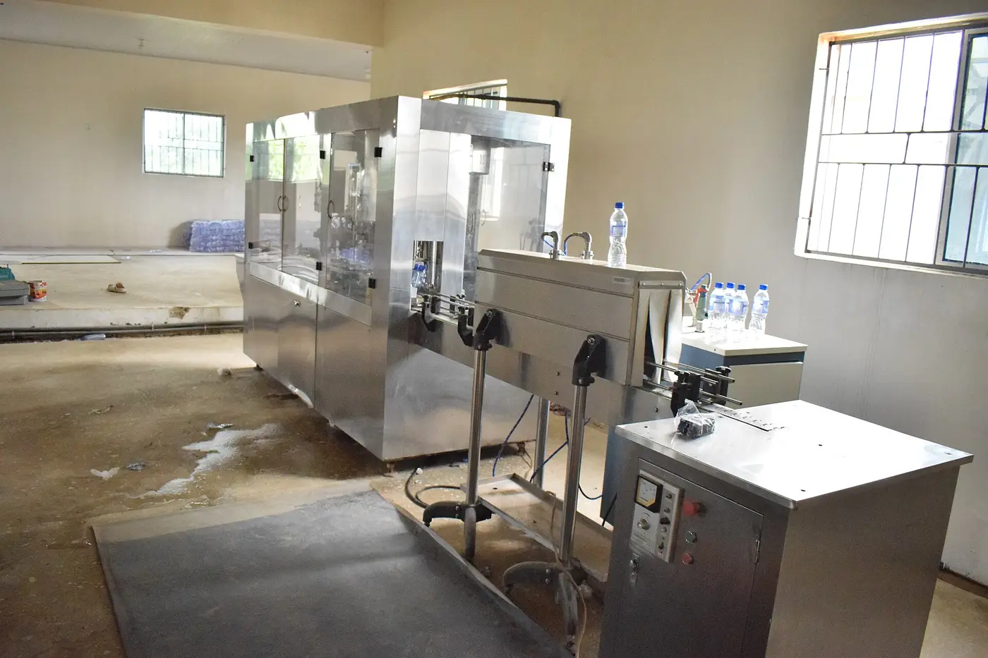 Bottled water filling and capping line in a Nigerian water factory