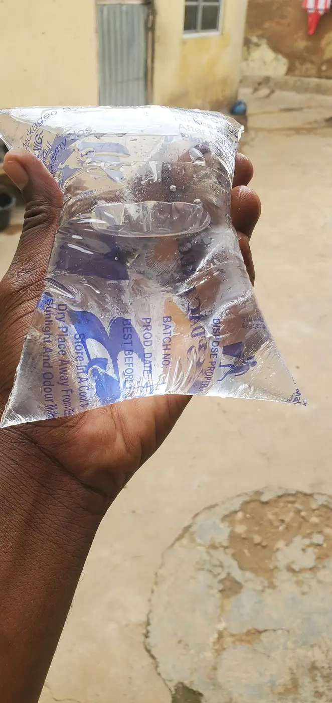 A sachet of pure water held in hand